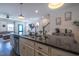 Stylish kitchen island with granite countertop and modern faucet at 777 Fireball Ct, Knightdale, NC 27545