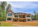 Spacious new construction home with a large backyard and a multi-level deck area at 7805 Ailesbury Rd, Wake Forest, NC 27587