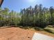 Expansive backyard with a partially wooded area perfect for privacy and enjoying nature at 7805 Ailesbury Rd, Wake Forest, NC 27587