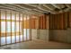 Unfinished basement showing the framework, insulation, and concrete foundation of the space at 7805 Ailesbury Rd, Wake Forest, NC 27587