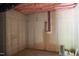 Unfinished basement showing concrete wall, water pipes, and other utilities for future customization at 7805 Ailesbury Rd, Wake Forest, NC 27587