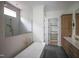Luxurious bathroom with a soaking tub, separate glass shower, and custom wood cabinets at 7805 Ailesbury Rd, Wake Forest, NC 27587