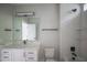 Stylish bathroom with marble countertop vanity, modern fixtures, bright lighting, and shower with tiled walls at 7805 Ailesbury Rd, Wake Forest, NC 27587
