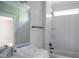 Unfinished bathroom featuring a tiled shower, tub, and a mirror above the vanity at 7805 Ailesbury Rd, Wake Forest, NC 27587