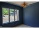 Airy bedroom with hardwood floors, natural light, and large windows with a view at 7805 Ailesbury Rd, Wake Forest, NC 27587