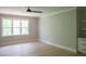 Spacious bedroom with hardwood floors, and a large window for ample natural light at 7805 Ailesbury Rd, Wake Forest, NC 27587