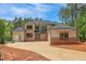 Stunning new construction home featuring a brick and siding exterior with a large driveway at 7805 Ailesbury Rd, Wake Forest, NC 27587