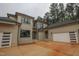 Modern exterior boasts a three-car garage and brick and siding accents, offering both style and ample parking space at 7805 Ailesbury Rd, Wake Forest, NC 27587