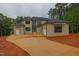 Stunning two-story home featuring brick and siding, an expansive driveway, and multiple garage doors at 7805 Ailesbury Rd, Wake Forest, NC 27587