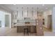 Modern kitchen featuring an island, breakfast bar, and stainless steel appliances at 7805 Ailesbury Rd, Wake Forest, NC 27587