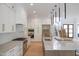 Spacious kitchen boasts stainless steel appliances, a large island and pendant lights at 7805 Ailesbury Rd, Wake Forest, NC 27587
