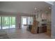 Open-concept room features hardwood floors and access to a outdoor porch at 7805 Ailesbury Rd, Wake Forest, NC 27587