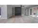 Spacious living room with a fireplace, wood floors, and sliding glass doors to the outdoors at 7805 Ailesbury Rd, Wake Forest, NC 27587