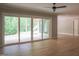 Bright living room with sliding glass doors offering access to the backyard at 7805 Ailesbury Rd, Wake Forest, NC 27587