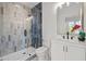 Modern bathroom showcasing a glass shower with stylish tiles and a vanity with gold accents at 805 Tower St # 102, Raleigh, NC 27607