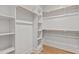 Large closet featuring custom shelving and wooden hanging rods for all your storage needs at 805 Tower St # 102, Raleigh, NC 27607