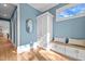 Entryway with built-in bench, storage, and a window offering natural light and a view of blue skies at 805 Tower St # 102, Raleigh, NC 27607