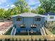 New construction duplex with two stories, gray siding, black trim, and individual fenced yards at 805 Tower St # 102, Raleigh, NC 27607