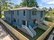 Modern home exterior featuring blue siding, white trim, and a fenced yard at 805 Tower St # 102, Raleigh, NC 27607