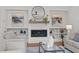 Cozy living room featuring a fireplace, built-in shelves, stylish decor and comfortable seating at 805 Tower St # 102, Raleigh, NC 27607