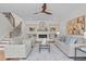 Inviting living room with fireplace, built-in shelving, hardwood floors, and comfortable seating arrangement at 805 Tower St # 102, Raleigh, NC 27607