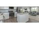 Modern kitchen featuring stainless steel appliances, white cabinets and granite countertops at 806 Bright Nova Way, Wendell, NC 27591