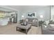 Stylish living room adjacent to a modern kitchen with stainless steel appliances at 806 Bright Nova Way, Wendell, NC 27591