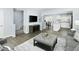 Open-concept living room next to stairs, kitchen and a dining room in this house at 806 Bright Nova Way, Wendell, NC 27591