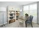 Inviting office space with natural light, desk, shelving, and modern chair at 806 Bright Nova Way, Wendell, NC 27591