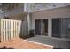 A fenced back patio area with mature landscaping, sliding glass doors, and privacy at 8511 Bright Loop, Raleigh, NC 27613