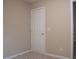 Neutral bedroom featuring a closed door at 8511 Bright Loop, Raleigh, NC 27613