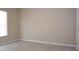 Neutral bedroom with neutral walls, carpet, and a window at 8511 Bright Loop, Raleigh, NC 27613