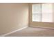 Bedroom with neutral walls, carpet, and a window with blinds at 8511 Bright Loop, Raleigh, NC 27613