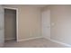 Neutral bedroom featuring a door to a closet at 8511 Bright Loop, Raleigh, NC 27613