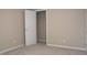 Neutral bedroom featuring a door to a closet at 8511 Bright Loop, Raleigh, NC 27613