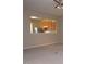 Comfortable living room with partial view into the kitchen with stainless steel appliances and wood cabinets at 8511 Bright Loop, Raleigh, NC 27613