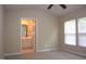 Light filled main bedroom with vaulted ceilings, carpet, and an ensuite bathroom at 8511 Bright Loop, Raleigh, NC 27613