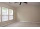 Bright and airy main bedroom with carpet floors, vaulted ceiling and natural light streaming in from the windows at 8511 Bright Loop, Raleigh, NC 27613