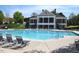 Community pool area with lounge chairs and clubhouse at 8511 Bright Loop, Raleigh, NC 27613