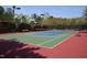Inviting community tennis court with net and surrounding greenery for outdoor recreation at 8511 Bright Loop, Raleigh, NC 27613