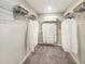 Organized walk-in closet with ample shelving, hanging space, and storage for clothing and accessories at 1000 Sora Way, Durham, NC 27703