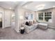 Inviting living room features a plush sofa, stylish decor, and large windows providing abundant natural light at 1000 Sora Way, Durham, NC 27703