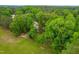 Aerial view of a home surrounded by lush greenery and a large, grassy yard at 101 Easton Ct, Garner, NC 27529