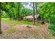 Enjoy a large wooded lot with a fire pit area and views of the back of the house at 101 Easton Ct, Garner, NC 27529