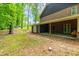 View of brick home with covered porch and storage building at 101 Easton Ct, Garner, NC 27529