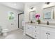 Bathroom featuring double sink vanity, tile floors, and glass shower at 101 Easton Ct, Garner, NC 27529