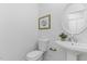 Half bathroom with toilet and sink, decor art on wall at 101 Easton Ct, Garner, NC 27529