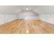 Finished bonus room with hardwood floors, white walls and trim, and peaked ceiling at 101 Easton Ct, Garner, NC 27529