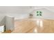 Large bonus room with hardwood floors, AC unit, and window overlooking the backyard at 101 Easton Ct, Garner, NC 27529