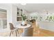 Dining area with built-in shelves and view into the open living spaces at 101 Easton Ct, Garner, NC 27529
